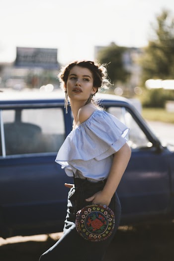 Woman in White Off-shoulder Top