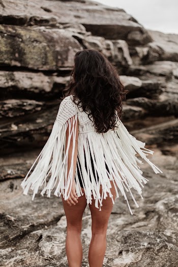 Woman in White Poncho
