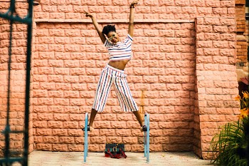 Woman in White-red-and-blue Striped Pants and Top