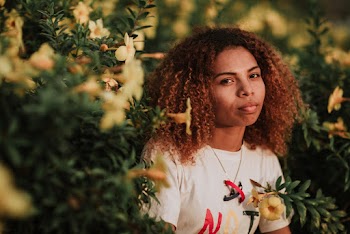 Woman in White Shirt on Flower Field