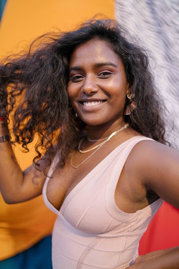 Woman in White Sleeveless Top