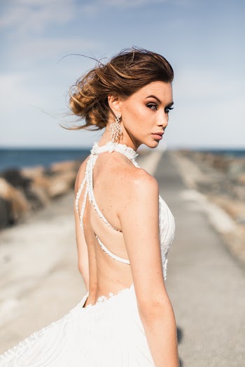 Woman In White Sleeveless Wedding Dress