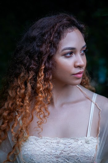 Woman in White Spaghetti Strap Top