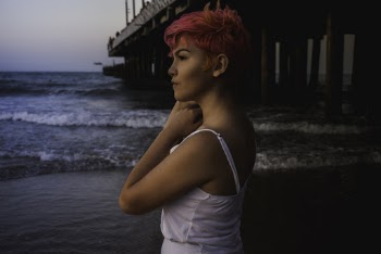 Woman In White Spaghetti Strap Top By The Sea