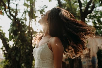 Woman in White Spaghetti Strap Under Green Dress