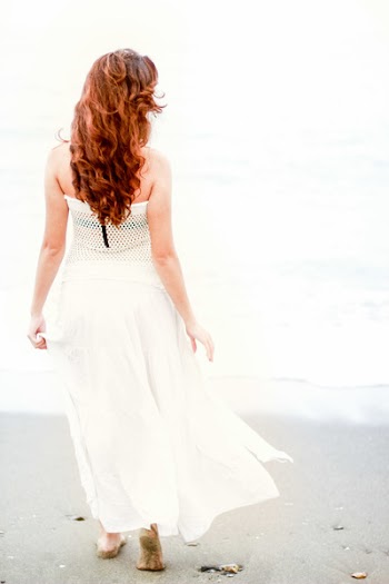 Woman in White Strapless Dress Looking at the Sea