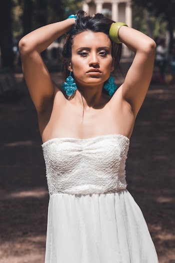 Woman in White Strapless Dress Standing Under Tree in Park
