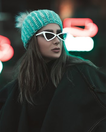 Woman in White Sunglasses