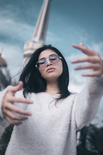 Woman in White Sweater About to Hug