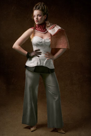 Woman in White Sweetheart Neckline Top and Gray Flare Pants