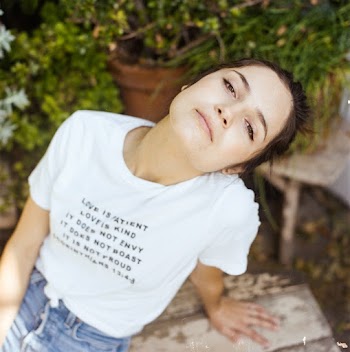 Woman in White T-shirt and Blue Denim Bottoms
