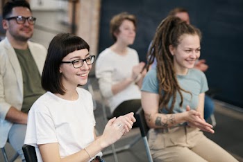 Woman in White T-shirt Clapping