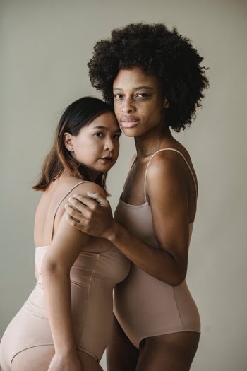 Woman in White Tank Top Hugging Woman in White Tank Top · Free Stock Photo