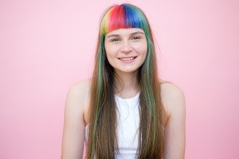 Woman in White Tank Top With Blue and Green Hair