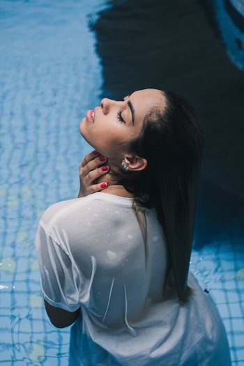 Woman In White Top Swimming
