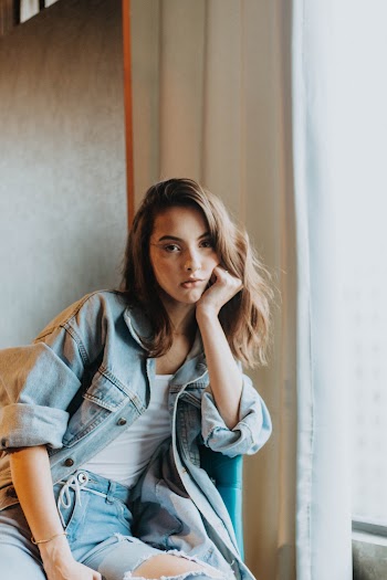 Woman In White Top Wearing Denim Jacket
