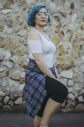 Woman in White Top Wearing Eyeglasses