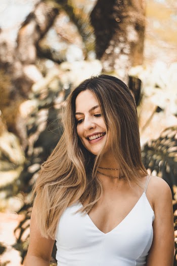 Woman in White V-neck Spaghetti Strap Top