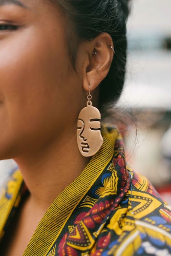 Woman in Yellow and Blue Top and Gold Earring