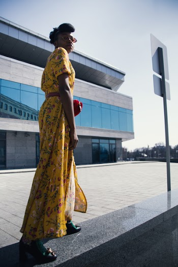 Woman in Yellow and Pink Floral Dress Standing