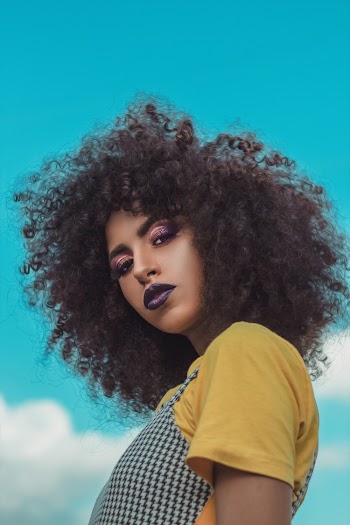 Woman in Yellow and White Shirt
