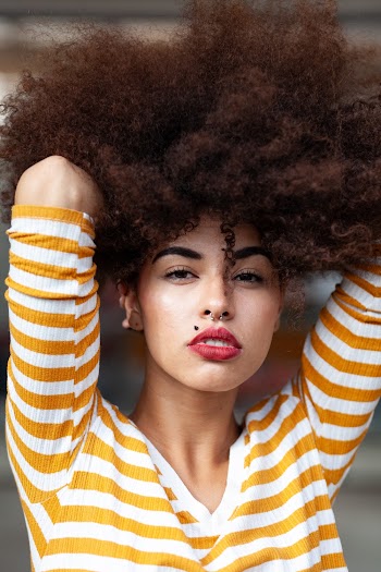 Woman in Yellow and White Striped Elbow-sleeved Shirt