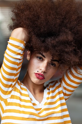 Woman in Yellow and White Striped Shirt