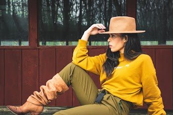 Woman in Yellow Sweater Sitting and Posing