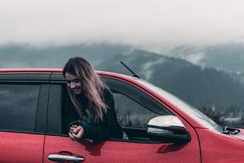 Woman Inside Red Vehicle