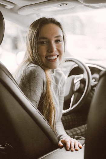 Woman Inside Vehicle Smiling