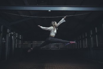 woman jumping inside room