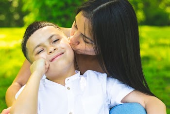Woman Kissing Boy