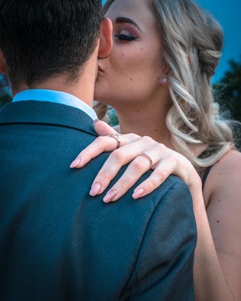 Woman Kissing Man on Cheek