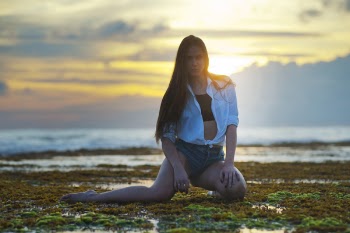 Woman Kneeling on Grass