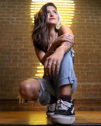 Woman Kneeling While Looking Away