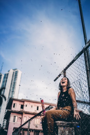 Woman Laughing Outdoor Near Fence