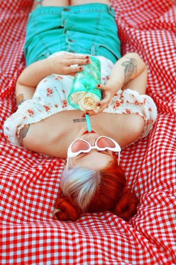 Woman Laying Down on Red Cloth