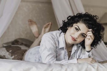 Woman Laying On Bed