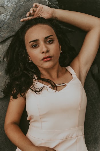 Woman Laying On Rock