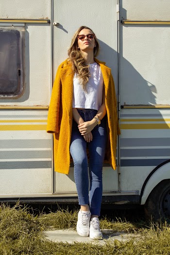 Woman Leaning Against Trailer