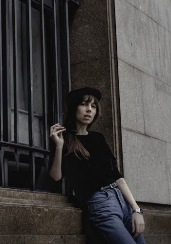 Woman Leaning Beside Wall