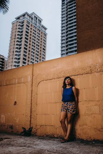 Woman Leaning Beside Wall