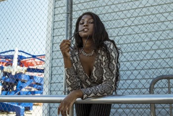 Woman Leaning Forward on Metal 