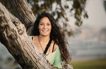 Woman Leaning Forward on Tree