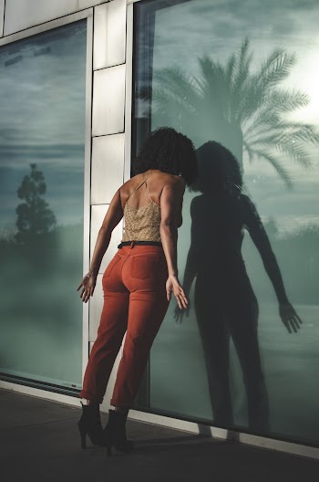 Woman Leaning Her Head on Glass