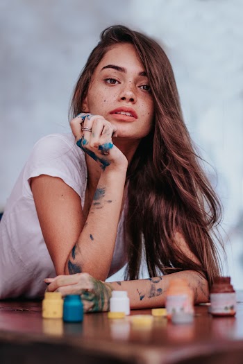Woman Leaning Her Head on Her Hand