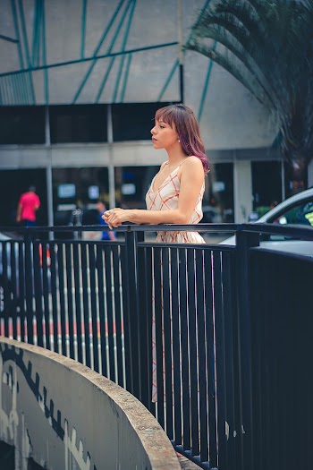 Woman Leaning on a Railing