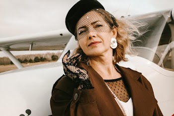 Woman Leaning on Aircraft