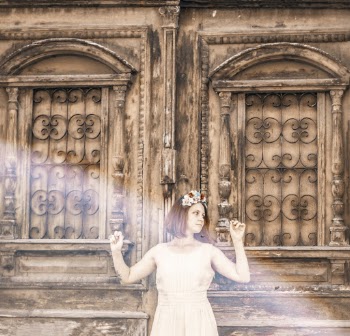 Woman Leaning on An Old Wooden Door