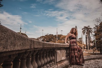 Woman Leaning on Baluster